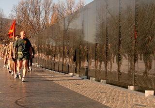 Marines slowing as they pass the Vietnam Memorial